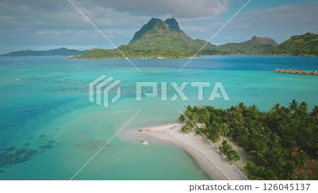 Breathtaking aerial view of Bora Bora in French Polynesia, featuring turquoise waters, lush greenery, iconic mount Otemanu, and luxurious overwater bungalows. Travel tropical vacation concept Breathtaking aerial view of Bora Bora in French Polynesia, featuring turquoise waters, lush greenery, iconic mount Otemanu, and luxurious overwater bungalows. Travel tropical vacation concept 126045137