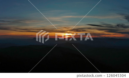 Rocky snow mountains at sunset aerial Rocky snow mountains at sunset aerial 126045304