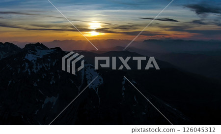 Rocky snow mountains at sunset aerial Rocky snow mountains at sunset aerial 126045312