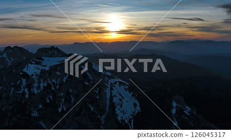 Rocky snow mountains at sunset aerial Rocky snow mountains at sunset aerial 126045317