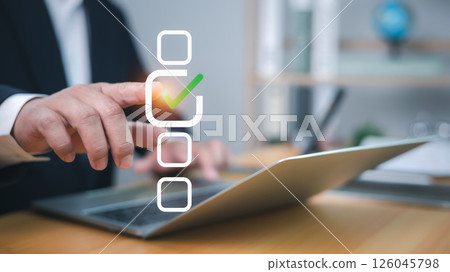 Businessman tick correct mark to approve document or project checklist, Application for certificate, Quality management and assurance, Business certification, Pass inspection, Accept approved, QA, QC 126045798