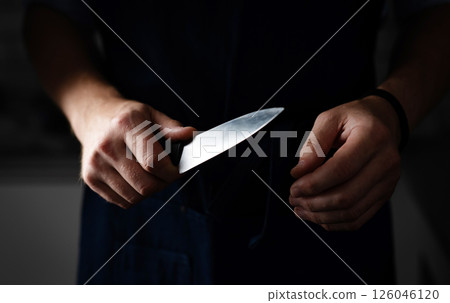 Dangerous Man Holds Sharp Knife In Darkness Dangerous Man Holds Sharp Knife In Darkness 126046120