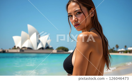 Woman at Sydney Opera House beach. 126046473
