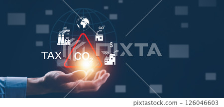 businessman holding a magnifying glass  Co2 Tax.Carbon tax concept , environmental and social responsibility business concept. Taxation for nature pollution. 126046603