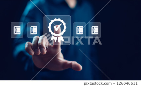 Quality assurance of business services, businessman Hand hold shows the sign of the top service Quality assurance, Guarantee, Standards, ISO certification and standardization concept. 126046611