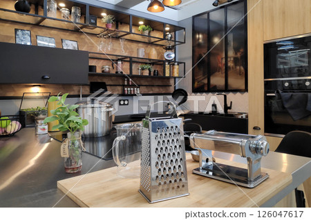 Stylish modern kitchen with an industrial touch Stylish modern kitchen with an industrial touch 126047617
