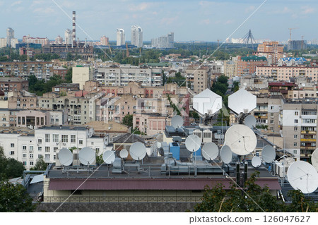 Satellite dishes on house roof 126047627