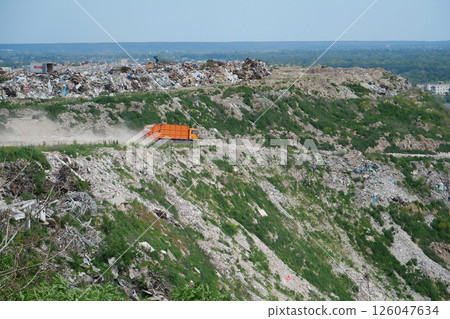 Garbage trucks at the city landfill 126047634