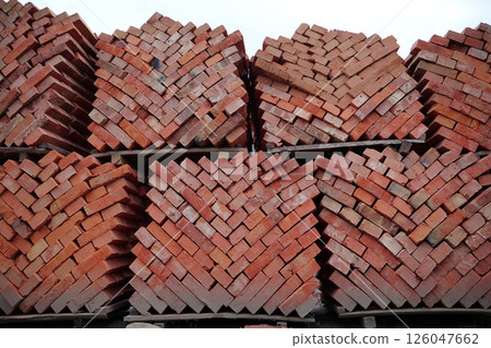 Stacks of red bricks at outdoor construction supermarket 126047662