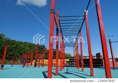 Sports ground with new exercise equipment in open air sport zone in the city 126047687