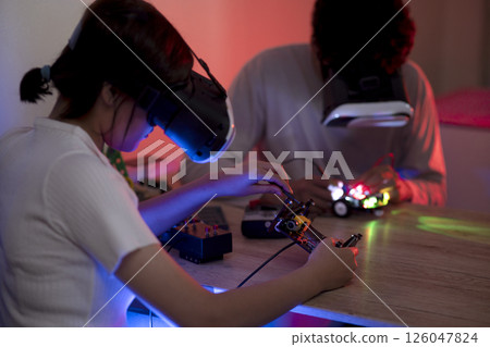 Young man and young woman amateur inventor 126047824