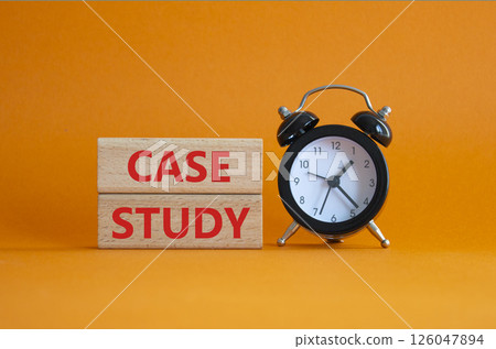 Case Study symbol. Wooden blocks with words Case Study. Beautiful orange background with alarm clock. Business and Case Study concept. Copy space. 126047894