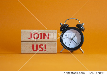Join us symbol. Concept word Join us on wooden blocks. Beautiful orange background with alarm clock. Business and Join us concept. Copy space 126047895