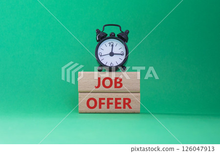 Job Offer symbol. Wooden blocks with words Job Offer. Beautiful green background with alarm clock. Business and Job Offer concept. Copy space. Job Offer symbol. Wooden blocks with words Job Offer. Beautiful green background with alarm clock. Business and Job Offer concept. Copy space. 126047913
