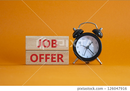 Job Offer symbol. Wooden blocks with words Job Offer. Beautiful orange background with alarm clock. Business and Job Offer concept. Copy space. 126047916