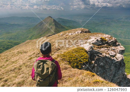 Woman Tourist with Backpack Travel in Mountains 126047993