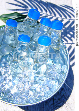 Ramune 7: Ramune chilled in the shade of palm leaves 126047998