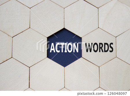 Action or words symbol. Concept word Action or words on wooden comb puzzle. Beautiful deep blue background. Business and Action or words concept. Copy space 126048097