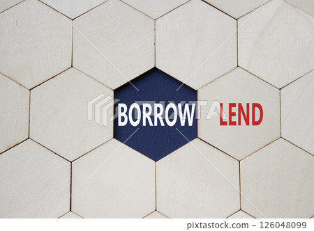 Lend or Borrow symbol. Concept word Lend or Borrow on wooden comb puzzle. Beautiful deep blue background. Business and Lend or Borrow concept. Copy space Lend or Borrow symbol. Concept word Lend or Borrow on wooden comb puzzle. Beautiful deep blue background. Business and Lend or Borrow concept. Copy space 126048099