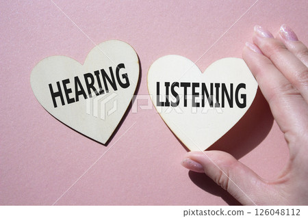Growth and Stability symbol. Concept word Growth and Stability on wooden hearts. Businessman hand. Beautiful pink background. Business and Growth and Stability concept. Copy space Growth and Stability symbol. Concept word Growth and Stability on wooden hearts. Businessman hand. Beautiful pink background. Business and Growth and Stability concept. Copy space 126048112