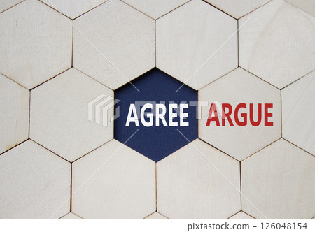 Agree or Argue symbol. Concept word Agree or Argue on wooden comb puzzle. Beautiful deep blue background. Business and Agree or Argue concept. Copy space 126048154