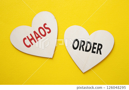 Chaos or Order symbol. Concept word Chaos or Order on wooden hearts. Beautiful white background. Business and Chaos or Order concept. Copy space 126048295