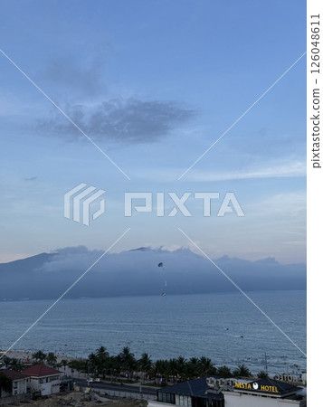 vertical photos vietnam danang beach Beautiful My Khe beach from drone in Da Nang, Vietnam, street and buildings near the Central beach and the sea. Photo from a drone 126048611