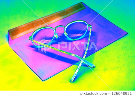 The glasses are in an open envelope. Corporate desktop, receiving correspondence. The glasses are in an open envelope. Corporate desktop, receiving correspondence. 126048931