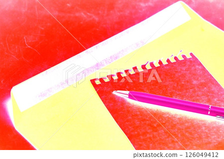 A sheet torn from a notebook in a cage on a paper envelope. Top view of a paper envelope. A sheet torn from a notebook in a cage on a paper envelope. Top view of a paper envelope. 126049412
