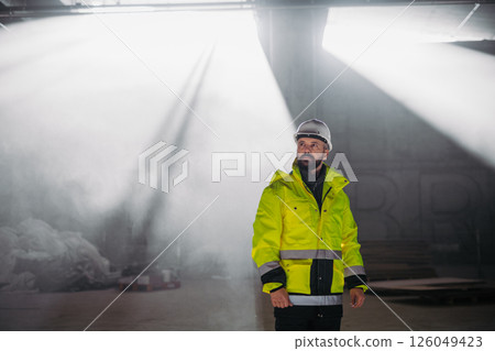 Portrait of construction foreman in modern building site. Portrait of construction foreman in modern building site. 126049423