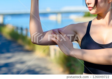 Cool woman exercising under the blue sky, biceps, exercise, movement, self-confidence, trimmed up Cool woman exercising under the blue sky, biceps, exercise, movement, self-confidence, trimmed up 126049722