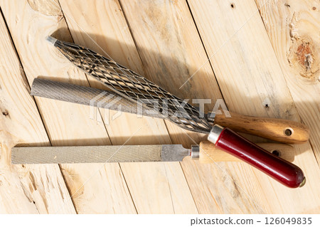 Top view of a Set of Rasps lying on wooden planks in a carpentry workshop 126049835