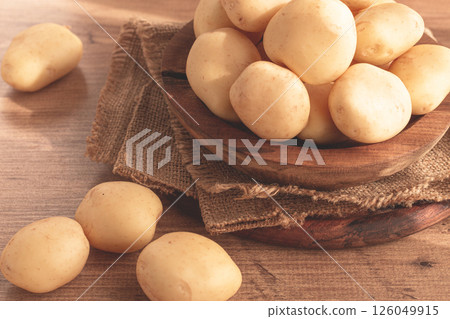 boiled new potatoes, in a wooden bowl, on a rustic table, natural light, no people, boiled new potatoes, in a wooden bowl, on a rustic table, natural light, no people, 126049915
