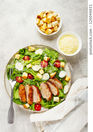 Caesar salad, with duck breast, on a light plate, on a light background, homemade, no people, Caesar salad, with duck breast, on a light plate, on a light background, homemade, no people, 126049931
