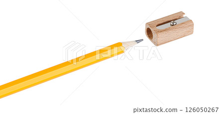 wooden pencil sharpener with a yellow pencil on white isolated backdrop. Perfect for school supplies, office, and art needs. 126050267
