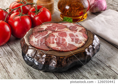 Italian Cured pork neck slices 126050441