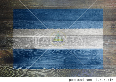Nicaragua flag on rustic old wood surface background Nicaragua flag on rustic old wood surface background 126050516
