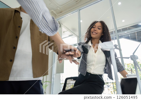 Sustainability engagement Professionals showcasing teamwork in office Sustainability engagement Professionals showcasing teamwork in office 126051495