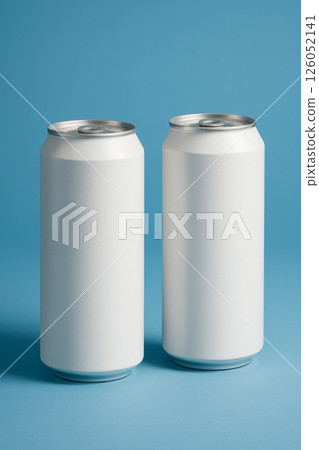 Two Blank Soda Cans on Blue Background Ready for Custom Designs and Branding Options 126052141