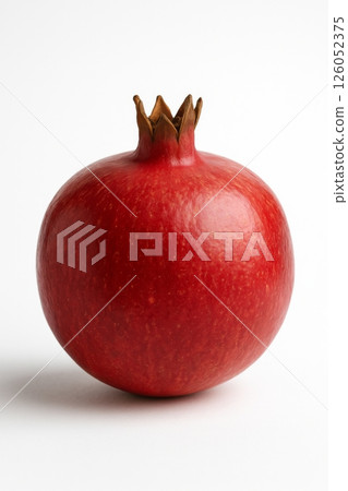 Vibrant Red Pomegranate Fruit Isolated on a White Background for Culinary Use and Decoration Vibrant Red Pomegranate Fruit Isolated on a White Background for Culinary Use and Decoration 126052375