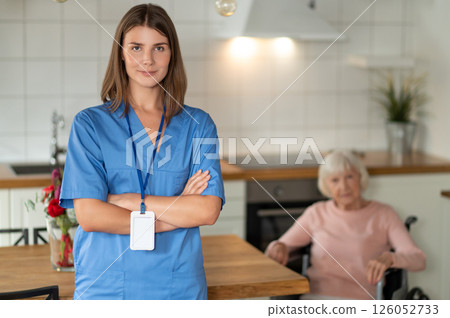 Nurse providing healthcare assistance support and care for elderly patient Nurse providing healthcare assistance support and care for elderly patient 126052733