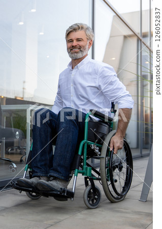 Mature man on a wheelchair looking determined and confident 126052837