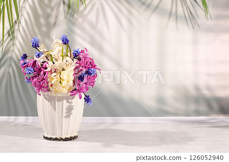 Beautiful still life of different varieties of hyacinths and muscari in a vase on an elegant kitchen background, template for design and screen. Abstract flower arrangement, banner. Spring postcard, Beautiful still life of different varieties of hyacinths and muscari in a vase on an elegant kitchen background, template for design and screen. Abstract flower arrangement, banner. Spring postcard, 126052940