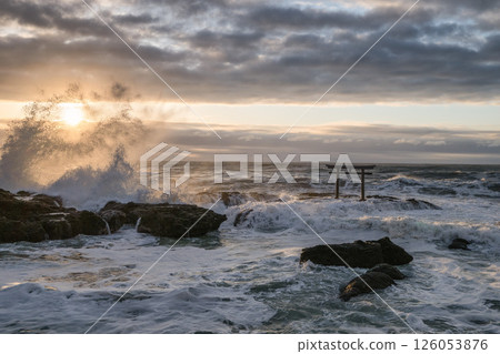 Rough sea and the torii gate of Kamiiso just after sunrise 126053876