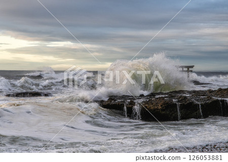 Rough sea and the torii gate of Kamiiso just after sunrise Rough sea and the torii gate of Kamiiso just after sunrise 126053881