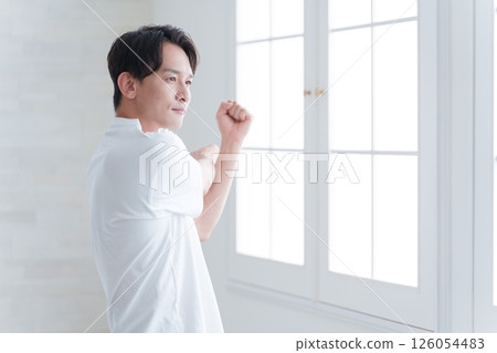 Middle-aged man stretching Middle-aged man stretching 126054483