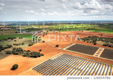 Solar panel farm and wind turbines in countryside Solar panel farm and wind turbines in countryside 126054760