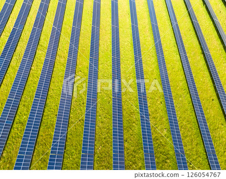 Photovoltaic Solar Panels in Green Field. Aerial View 126054767