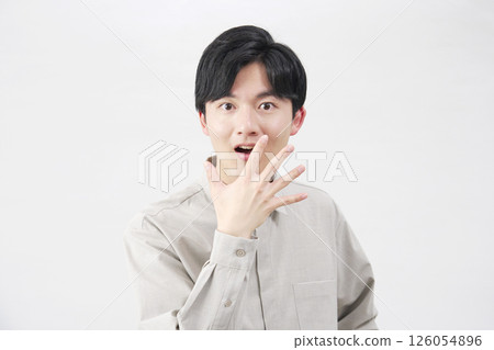 Man in his 20s, surprised, white background 126054896