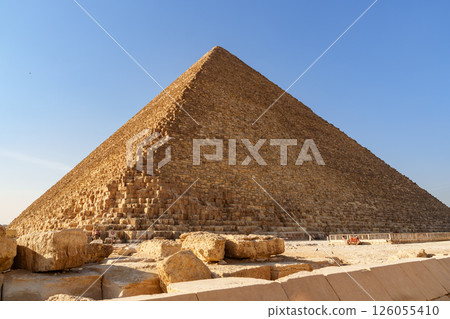 Exploring the grandeur of the Great Pyramid of Giza under a clear blue sky 126055410